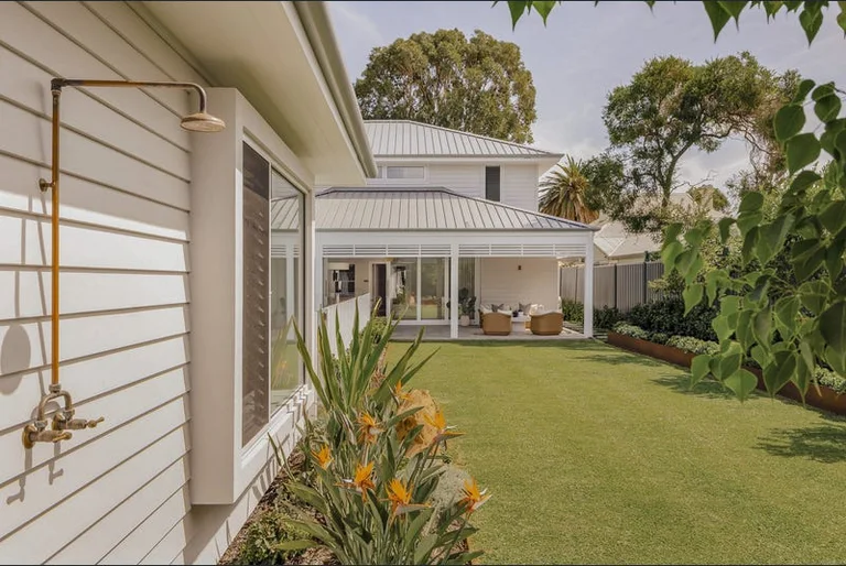 Rear elevation and garden of the Cottesloe home, with covered alfresco