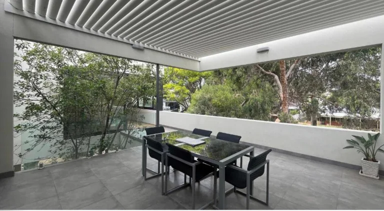 Covered alfresco dining terrace with louvered roof and glass balustrade, Wembley Downs